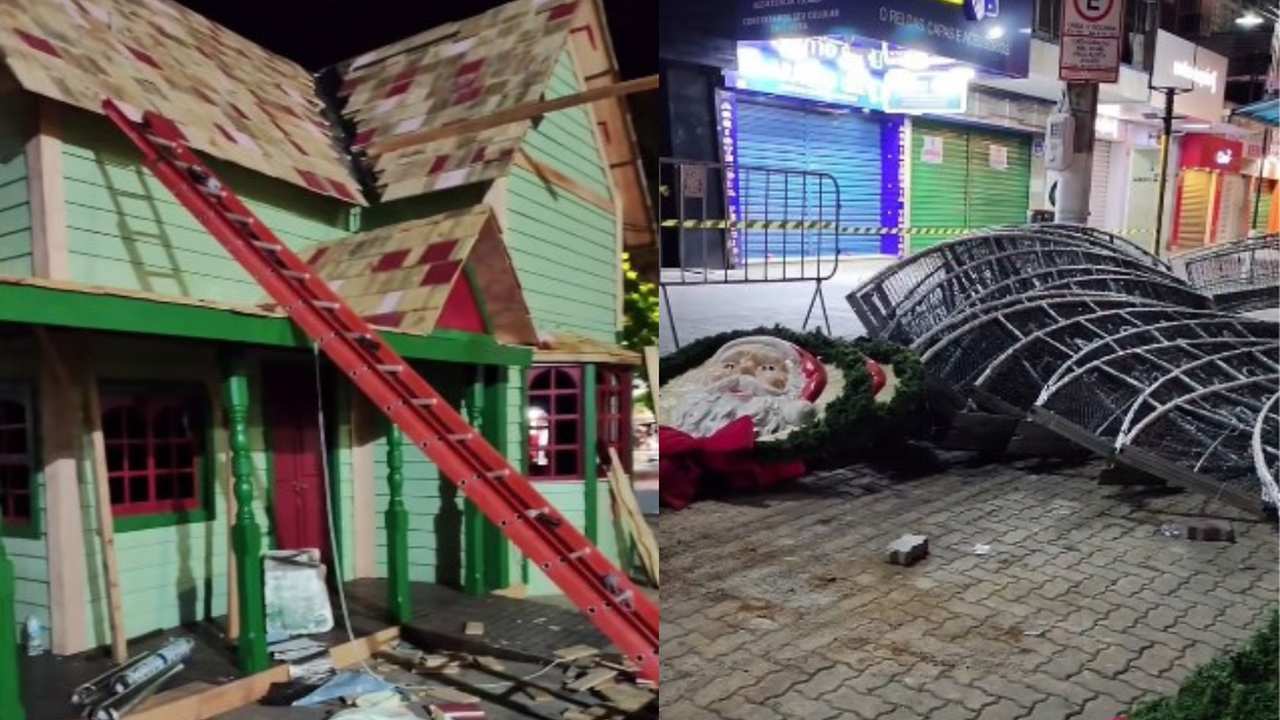 Decoração de Natal danificada: casa de madeira com escada e estruturas metálicas no chão.
