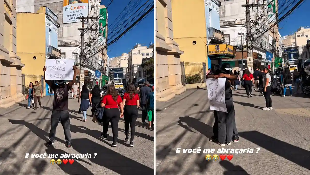Homem vendado recebe abraço diante da Igreja de São João Batista, no Centro de Nova Friburgo
