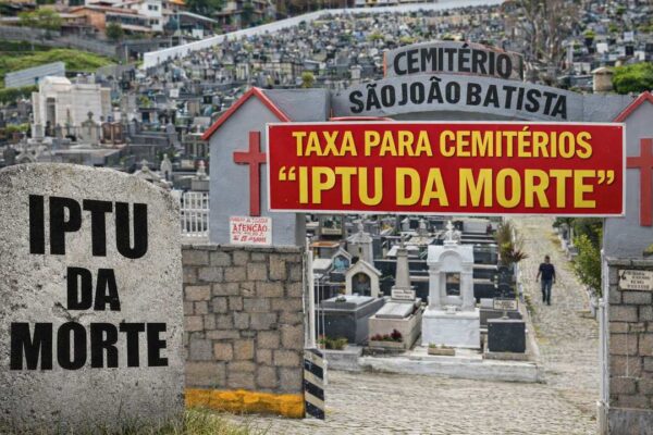 Placa de IPTU da morte em cemitério São João Batista, com aviso sobre taxa para cemitérios.