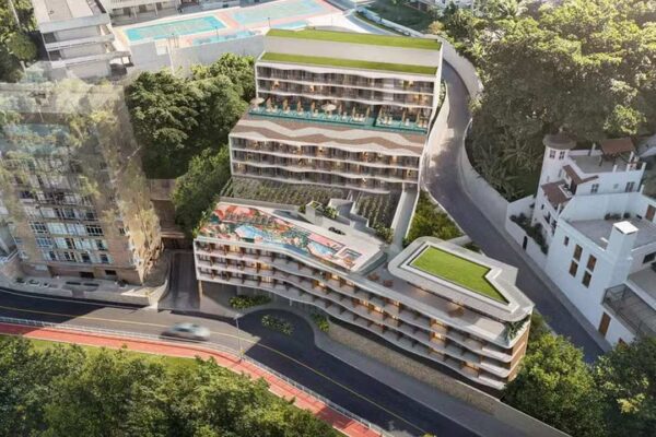 Projeto Costa Niemeyer: Renderização de edifício com vista para o mar no Rio de Janeiro.