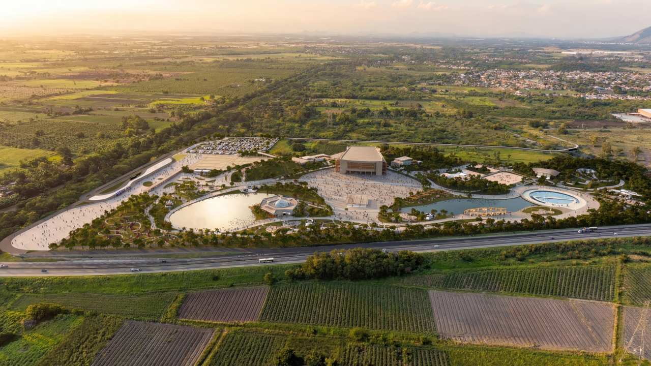 Renderização do Parque Terra Prometida em Santa Cruz, projeto com área verde, lagoas e edifícios.